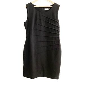 Calvin Klein • black sheath dress with starburst waist detail • 16
